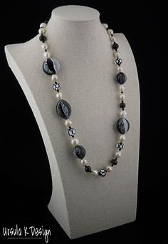 "26\" necklace of handblown glass beads in black & white and a variety of different shapes (2 @ 25x27x15mm, 1 @ 20x23mm, 1 @ 20x19mm, 5 @ 15x12mm), faceted 11mm round Spinel beads, 6mm Swarovski jet crystal bicones, graduated white Baroque pearls ranging from 12 to 10mm, sterling silver box clasp. This truly one-of-a-kind necklace will make a splash with any black, white or black & white outfit you own. The glass beads were created by Patti Walton, a well-known Colorado artist who is fam Black And White Round Bead Jewelry, Elegant White Czech Glass Jewelry, Elegant Handmade Black And White Jewelry, Jet Crystal, Keshi Pearl Necklace, White Beaded Necklaces, Jewelry Black, White Outfit, Box Clasp