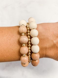 "This Rosary bracelet stack includes one Rosary bracelet, one dainty gold-filled bracelet and one rosewood bracelet with coordinating natural wood beads to match your Rosary bracelet. Mix and match our bracelets any way you like. These white wood beads are a soft cream color. The Rosary stretch bracelet is made with rosewood, gold filled beads, natural white wood beads and is finished with a gold filled Miraculous Medal. Your reminder to pray will be close at hand. Made to encourage prayer, the Everyday Wooden Beads Bracelets, Everyday Gold Stretch Bracelet With Wooden Beads, Wood Bead Bracelet, Rosary Bracelet, The Rosary, Dainty Bracelet, 2024 Christmas, Bracelet Ideas, Miraculous Medal