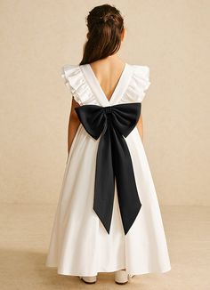 Let your flower girl have fun walking down the aisle while tossing petals in our matte satin dress, Aero. She features a scoop neckline, a beautiful V-back, a lovely bow tie belt, a ruched A-line skirt, and adorable flutter sleeves. This dress is not only perfect for a flower girl at a wedding but also versatile enough for other special occasions. Satin Flower Girl Dresses, Fun Walk, Belt Tying, Matte Satin, Walking Down The Aisle, Satin Dress, Flutter Sleeves, Tie Belt, Satin Dresses