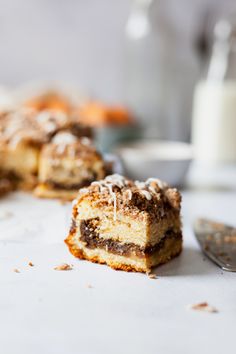 two pieces of dessert sitting on top of a table