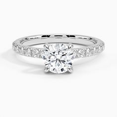 a white gold engagement ring with diamonds on it