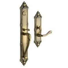 an antique style door handle with ornate details