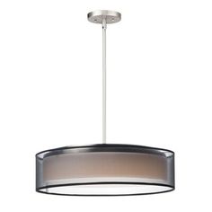 a light fixture with a circular shade on the bottom and one light hanging from the ceiling