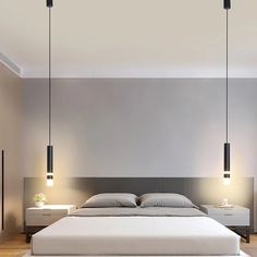 a large bed sitting in a bedroom next to two lamps on either side of it