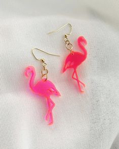 "This cute, retro, hot pink flamingo brings back the kitschy lawn ornament of the 60s, laser-cut from fluorescent neon pink acrylic. Very lightweight and easy to wear all day!  Earring wire is gold and 100% nickel-free. Length of design: 1.75\", length including wire: 2.5\" Makes a great birthday gift, bachelorette party or wedding party favor. Designed and lasercut in Las Vegas, Nevada." Novelty Pink Earrings For Summer, Pink Novelty Earrings For Party, Flamingo Neon, Retro Flamingo, Flamingo Design, Wood Earrings Stud, Flamingo Earrings, Lawn Ornament, Earrings Acrylic