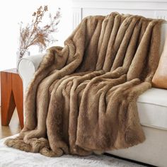 PRICES MAY VARY. Fleece,microfiber 2 BLANKETS IN 1: Our soft blanket features faux fur on one side, and plush velvet on the other side, captures the authentic look and plush feel of genuine fur. Available in 50"x60" and 60"x80" options. CLASSY & ELEGANT: Crafted with long hair faux fur on the top side and solid mink on the backside, our tipped fur blanket will take your home decor to a whole new level. PERFECT for SOLO USE or SHARING: Our soft throw blanket measures 50"x60" and 60"x80". This com Gold Rabbit, Rainbow Plush, Faux Fur Throw Blanket, Luxury Throws, Faux Fur Blanket, Fur Throw Blanket, Fur Blanket, Plush Throw Blankets, Fur Throw