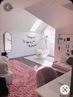 a bedroom with a hammock hanging from the ceiling and pink rugs on the floor