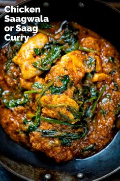 chicken saagwala or saag curry in a skillet with spinach