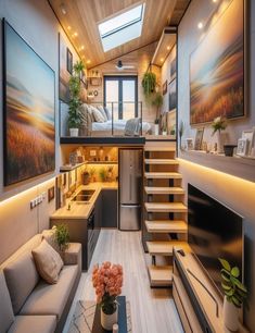 the interior of a tiny home with stairs leading up to the loft and living room