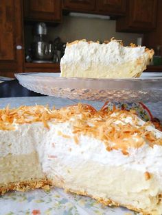 a large piece of cake sitting on top of a table next to a pie pan