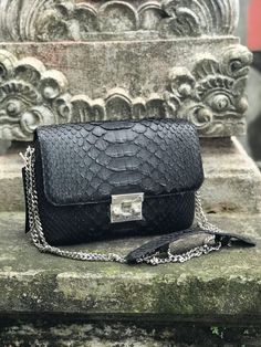 Genuine python skin bag PETRA  Size 22/16/7 cm (8.66/6.29/2,7 inches) Color: black  Face: genuine python skin  Lining: eco suede (textile) Handmade in Bali with lots of love  This is a made to order item, usually it takes from 1-2 weeks to ship it depending on tailors capacity and bali local holdays If you need any adjustments please feel free to message me NOTE:  we use one pattern  but each garment is unique and is slighly different, as it is 100% handmade and sewn from genuine python where ev Luxury Snake Print Shoulder Bag For Daily Use, Luxury Snake Print Shoulder Bag, Luxury Snake Print Shoulder Bag For Everyday, Luxury Rectangular Snake Print Bag, Luxury Snake Print Bag For Everyday Use, Elegant Rectangular Bag With Snake Print, Elegant Snake Print Shoulder Bag For Daily Use, Luxury Evening Bag With Snake Print, Luxury Snake Print Evening Bag