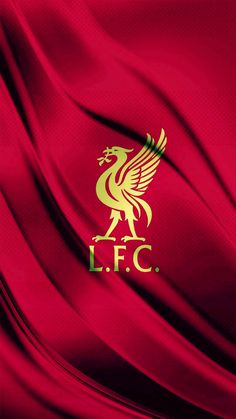 the liverpool football club logo on a red silk background