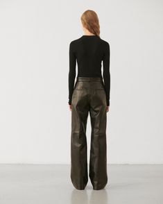 High-waist wide leg trousers in supple plongé leather with front slash pockets, back welt pockets, and hidden waistband closure. High Waist Wide Leg Trousers, Black High Waist, Knitwear Tops, Wide Leg Trousers, Welt Pockets, Welt Pocket, Shoe Collection, Outerwear Jackets, Jacket Dress