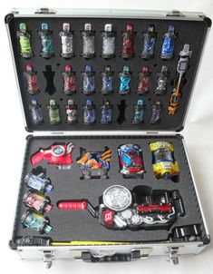 an open suitcase filled with assorted toy cars