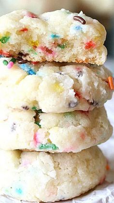 three cookies with sprinkles stacked on top of each other