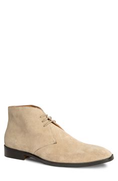 A slightly raised heel adds modern style to a low profile chukka boot crafted from velvety suede and set on a flexible rubber sole. 1 1/4" heel 4" shaft Leather upper and lining/rubber sole Imported Formal Suede Lace-up Boots With Plain Toe, Classic High-top Suede Desert Boots, Suede Boots With Suede Lining For Derby, Formal Suede Round Toe Chukka Boots, Formal Suede Chukka Boots With Round Toe, Classic Suede Boots For Derby, Beige Suede High-top Desert Boots, Beige High-top Suede Desert Boots, Classic Suede Lace-up Boots For Formal Occasions