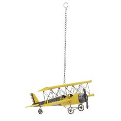 a small yellow airplane suspended from a chain on a white background with clippings