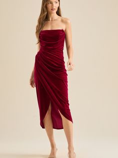 This strapless cowl neck overlay velvet midi dress is perfect for any occasion. The soft velvet fabric and drape create a sophisticated and timeless look. Strapless Velvet Dress, Football Dress, Bow Mini Dress, Holiday Party Dress, Velvet Midi Dress, Holiday Party Dresses, Strapless Mini Dress, Altar'd State, Shop Maxi Dresses