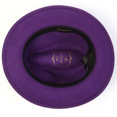 Upgrade your hat game with our Montique Purple Lightfelt 2 ½" Wide Brim Wool Felt Pinch Hat featuring a stylish feather accent. Crafted from 100% wool, this hat boasts a sophisticated pinch crown design and a classic 2 1/2" brim. Complete with a grosgrain ribbon for added charm, this hat exudes elegance and style. With no lining, it's lightweight and comfortable for all-day wear. Pinch crown design Chic feather accent Solid Color Made from 100% wool 2 1/2" brim Grosgrain ribbon No lining for lig Adjustable Purple Felt Hat With Flat Brim, Adjustable Wide Brim Purple Fedora, Wide Brim Purple Winter Hat, Handmade Purple Brimmed Hat, Luxury Purple Wide-brim Hat, Happy Hat, Hat Size Chart, Crown Design, Wide Brimmed Hats