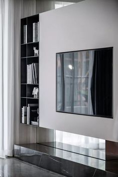 a modern living room with black and white decor