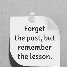 a piece of paper with the words forget the past, but remember the lesson on it