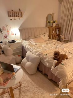 a bed room with a neatly made bed and a teddy bear sitting on the bed