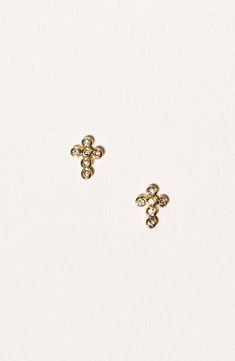 Round cubic zirconia illuminate these dainty cross stud earrings that'll lend meaningful shine to any ensemble. 1/8"W x 1/4"L Post back 18k-gold fill/cubic zirconia Made in the USA of imported materials Small Cross Earrings, Cross Earring Stud, Gold Cross Earrings Stud, Gold Cross-shaped Pierced Earrings, L Post, Cross Stud Earrings, Child Of Wild, Cross Earrings Studs, Holy Cross