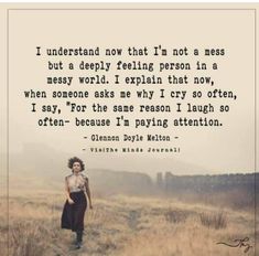 a woman standing in a field with a quote on it that says, i understand not that i'm not a mess but a deeply feeling person in a messy world