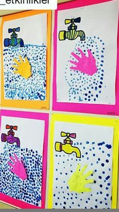 handprints are displayed on the wall in front of a child's artwork