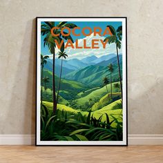 there is a poster on the wall that says cocora valley with palm trees and mountains in the background