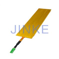 an image of a yellow piece of material with wires attached to it on a white background