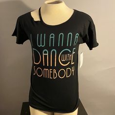 A Comfy, Super Soft T-Shirt From Lyric Culture With The Lyrics "I Wanna Dance With Somebody". A Great Statement Piece For Any Casual And/Or Sporty Outfit! Brand New With Tag Still Attached! The Song's Lyrics Are Printed On The Inside Of The Shirt, In The Back. Cool!! Originally From Hard Rock Hotel Orlando, From The Brand Lyric Culture. This Garment Has Never Been Worn And Is Washed/Cleaned. We Cannot Guarantee Exact Color In The Photos, Based On Various Technologies With Screens On Devices. Black Stretch Pre-shrunk Tops, Black Stretch Tops, Hard Rock Hotel Orlando, Top Lyrics, Sporty Outfit, Hard Rock Hotel, Sporty Outfits, Hard Rock, Orlando