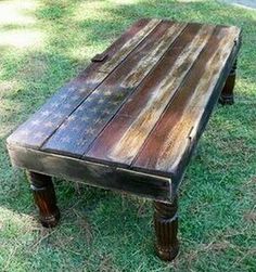 an old wooden bench sitting in the grass