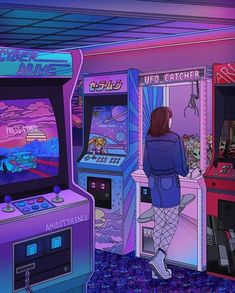 a woman standing in front of an arcade machine