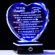 a blue heart shaped glass plaque with the words i love my daughter