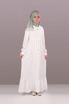 Child Hijab Dress Nadide Model White Product Features   Fabric Feature: It is made of crepe (cotton) fabric. It can be used in 4 seasons. Product Features : Produced with crepe (cotton) fabric. The collar part has a baby collar and frill detail. It has an ornamental button on the front and an adjustable drawstring. It has a hidden zipper on the back. The sleeve ends are rubber. Note:  If you are looking for a different color, visit our Etys store.  https://www.etsy.com/shop/MevlanaKidsAbaya The White Abaya With Modesty Panel For Eid, Modest White Dress For Eid, Arabic Abaya, Dress Arabic, Kids Abaya, Girl Dress White, Eid Dress, Muslim Kids, Muslim Girl