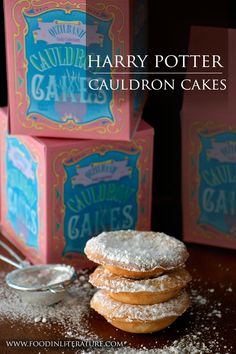 three harry potter cauldron cakes are stacked on top of each other with powdered sugar