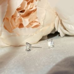 These elegant everyday stud earrings handcrafted in 14K white gold, feature colorless emerald cut fine moissanite. Made to Order Ship within 3-4 weeks. - Stone info: Fine moissanite, D/VVS quality, 6x4mm emerald cut - Ct weight: 1.2ctw - Sold as A Pair. - The earrings come with 14K solid gold backings. - Made in 14 karat gold. - Stamp with 14K. Emerald Cut Diamond Earrings In White Gold, Baguette Cut White Gold Diamond Earrings For Gift, Silver Emerald Cut Diamond Earrings With Baguettes, Silver Emerald-cut Baguette Diamond Earrings, Diamond White Baguette Cut Sterling Silver Earrings, Fine Jewelry Emerald-cut Lab Grown Diamond Earrings, Silver Emerald Cut Diamond Earrings, Silver Emerald Cut Lab Grown Diamond Earrings, Timeless Emerald Cut White Gold Earrings