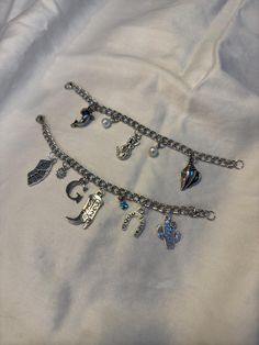 ♡ welcome to the custom charm bracelet shop! ♡ enjoy 15% off all orders until november 30th to celebrate the opening of our shop! (minimum order of $20) code: CHARMD15 as our business grows, we will be adding more charms and chains, so keep an eye out for new styles! how it works: 1. pick a chain length 2. pick how many charms you would like (maximum of 10; want more than 10? message me!) 3. choose your charms and charm layout 4. in the personalization section, let us know which charms you've pi Custom Charm Bracelet, Charm Bracelet Silver, Bracelet Shop, Diy Charm Bracelet, New Charmed, Custom Charms, Silver Chain Bracelet, Diy Charms, Bracelet Silver