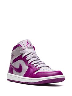 "Find JORDAN Air 1 Mid \"\"magenta\"\" Sneakers on Editorialist. purple/grey leather signature Air Jordan Wings logo signature Swoosh logo detail contrasting panel detail round toe front lace-up fastening logo patch at the tongue ankle-length branded insole rubber sole These styles are supplied by a premium sneaker marketplace. Stocking only the most sought-after footwear, they source and curate some of the most hard to find sneakers from around the world." Mid-top Purple Leather Sneakers, Sporty Purple Leather High-top Sneakers, Purple Mid-top Leather Sneakers, Purple Leather Mid-top Sneakers, Purple Basketball Shoes With Contrast Sole, Sporty Purple High-top Sneakers With Contrast Sole, Purple Lace-up Basketball Shoes With Contrast Sole, Purple Leather High-top Sneakers With Boost Midsole, Purple Leather Mid-top Basketball Shoes