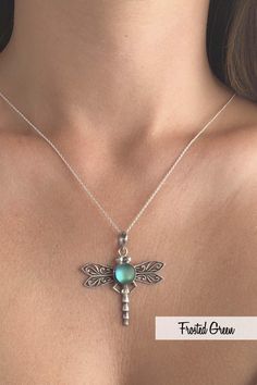 If a dragonfly lands on you, it's good luck! Add some fun to your outfit with this beautifully designed sterling silver and crystal Dragonfly Pendant by LeightWorks. Our handmade necklace is a great statement piece, with glowing crystal surrounded by intricate silver details in the dragonfly wings and body. Wear our pendant on a chain or try it with one of our silver swirl or slide chokers for an even bolder look. Sterling silver components. Sterling silver .7mm box chain, 18" included with pend Dragonfly Shaped Sterling Silver Jewelry Gift, Sterling Silver Dragonfly Jewelry Gift, Elegant Sterling Silver Dragonfly Jewelry, Elegant Sterling Silver Dragonfly Necklace, Silver Dragonfly Jewelry, Bohemian Silver Dragonfly Necklace, Handmade Sterling Silver Dragonfly Jewelry, Nickel-free Sterling Silver Dragonfly Jewelry, Sterling Silver Dragonfly Necklace