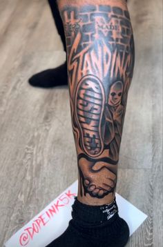 a person with a tattoo on their leg