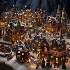 a christmas village is shown with lights and snow on the ground, including houses and trees