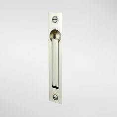 an open door handle on a white wall