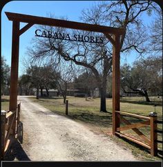 the entrance to carava shores is shown in this photo from across the dirt road