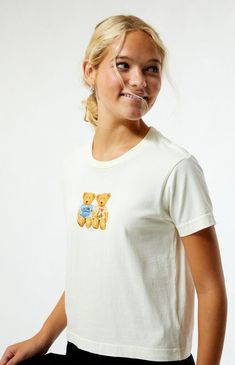 The Teddy Bear T-Shirt from PS / LA brings a cute, playful vibe to your look. It has short sleeves, a crew neckline, and a teddy bear graphic on the front. The slightly cropped length and relaxed boxy fit make it perfect for a laid-back, casual style.Solid color teeShort sleevesCrew necklineFront graphicRelaxed boxy fitSlightly cropped length100% cottonMachine washableModel is wearing a size smallModel measurements: 5’7.5” height, 32” bust, 24” waist, 35” hips PS / LA Womens Teddy Bear T-Shirt - White size XS White Short Sleeve T-shirt With Bear Print, Trendy Crew Neck T-shirt With Bear Print, Casual Bear Design Crew Neck Top, White Cotton Tops With Bear Print, Casual Cotton T-shirt With Bear Design, White Short Sleeve Top With Bear Print, Cotton Tops With Bear Print And Relaxed Fit, White Graphic Tee With Bear Print, Casual White T-shirt With Bear Print