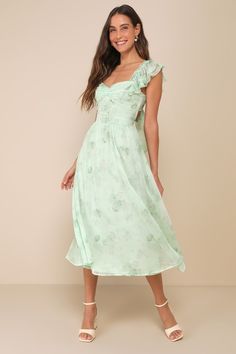 You'll be doted on all day long when you step out in the Lulus Loveliest Darling Light Green Floral Ruffled Tie-Back Midi Dress! Airy chiffon fabric, with a darling floral print throughout, shapes a sweetheart neckline, a center ruched bodice, and short, ruffled sleeves with elastic at the shoulders. A fitted, set-in waist sits atop a skater skirt that falls to a chic midi hem while a trendy tying detail at back creates a flirty finish! Elastic at back makes for best fit. Fit: This garment fits true to size. Length: Mid-calf length. Size medium Bust: Great for any cup size. Waist: Fitted - elastic waist allows stretch. Hip: Not Fitted - fuller skirt allows room for hips. Undergarments: May be worn with an adhesive bra, petals, or no bra. Fabric: Fabric has no stretch. Lined. Shell: 100% Po Midi Spring Dress, Spring Midi Dress, Ruffled Midi Dress, Summer Prints Fashion, Midi Dress Floral, Lulus Dresses, Midi Ruffle Dress, Adhesive Bra, Green Floral Dress