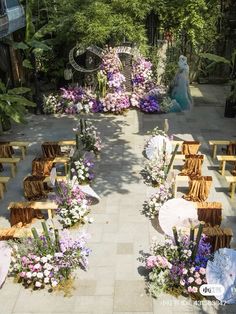 an overhead view of a wedding ceremony with flowers and chairs