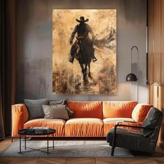 a living room filled with furniture and a painting on the wall above it's couch