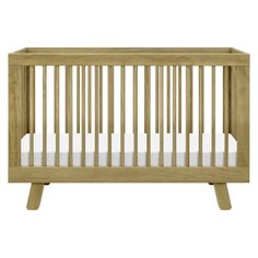 a wooden crib with white sheets on the bottom and side rails, against a white background